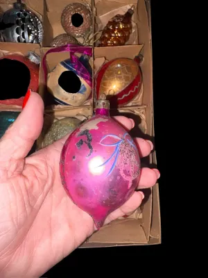 Sale Photo Thumbnail #104: A charming assortment of 13 vintage Christmas ornaments featuring both glass and plastic examples in a variety of classic holiday styles. Includes mercury glass ornaments, an indented reflector ornament, mosaic glass ornaments, a textured pinecone ornamen