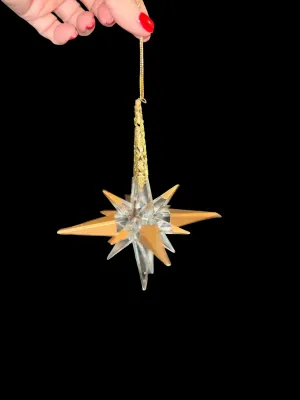 Sale Photo Thumbnail #115: Add elegant sparkle to your holiday décor with this lot of five Traditions AAF acrylic star snowflake ornaments. Each ornament features a dimensional clear acrylic starburst design accented with metallic gold points and ornate gold-tone cone caps with ha