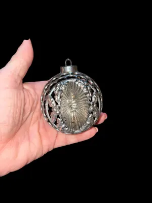 Sale Photo Thumbnail #99: A charming assortment of 13 vintage Christmas ornaments featuring both glass and plastic examples in a variety of classic holiday styles. Includes mercury glass ornaments, an indented reflector ornament, mosaic glass ornaments, a textured pinecone ornamen