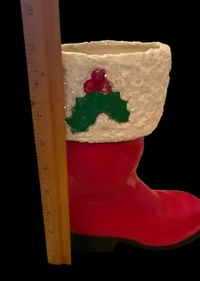 Sale Photo Thumbnail #55: Life-Size Ceramic Santa Boot Planter/Vase
Festive life-size ceramic Santa boot featuring a glittered faux-snow cuff with holly accents. Perfect as a planter, floral arrangement holder, or holiday décor. Measures approximately 8½" tall. Good vintage cond