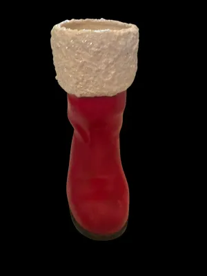 Sale Photo Thumbnail #48: Life-Size Ceramic Santa Boot Planter/Vase
Festive life-size ceramic Santa boot featuring a glittered faux-snow cuff with holly accents. Perfect as a planter, floral arrangement holder, or holiday décor. Measures approximately 8½" tall. Good vintage cond