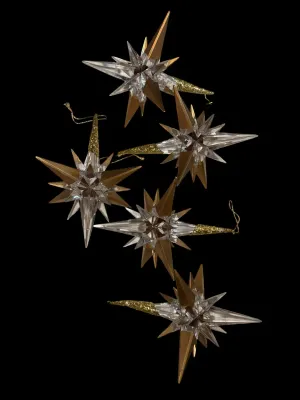 Sale Photo Thumbnail #114: Add elegant sparkle to your holiday décor with this lot of five Traditions AAF acrylic star snowflake ornaments. Each ornament features a dimensional clear acrylic starburst design accented with metallic gold points and ornate gold-tone cone caps with ha