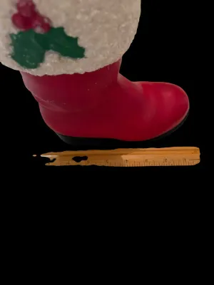 Sale Photo Thumbnail #53: Life-Size Ceramic Santa Boot Planter/Vase
Festive life-size ceramic Santa boot featuring a glittered faux-snow cuff with holly accents. Perfect as a planter, floral arrangement holder, or holiday décor. Measures approximately 8½" tall. Good vintage cond