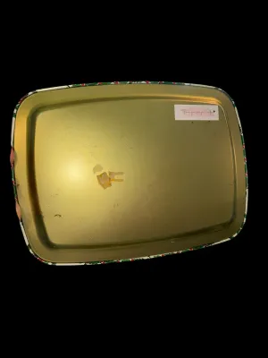 Sale Photo Thumbnail #108: The tray is constructed of lightweight tin with a gold-tone underside and rolled edges. It shows normal vintage wear consistent with age and use, including light scratches, small scuffs, minor finish wear, and adhesive residue on the underside from a prev