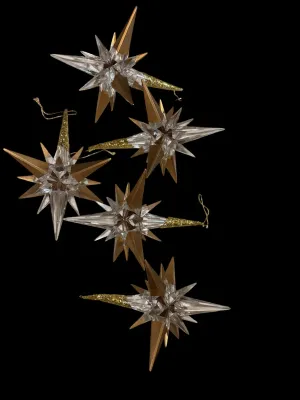 Sale Photo Thumbnail #113: Add elegant sparkle to your holiday décor with this lot of five Traditions AAF acrylic star snowflake ornaments. Each ornament features a dimensional clear acrylic starburst design accented with metallic gold points and ornate gold-tone cone caps with ha