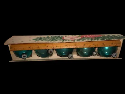 Sale Photo Thumbnail #125: Vintage set of five Shiny Brite glass Christmas ball ornaments in their original "Shiny Brite" box. These American-made ornaments feature a beautiful teal blue mercury glass finish with ribbed metal caps and are perfect for mid-century Christmas decoratin
