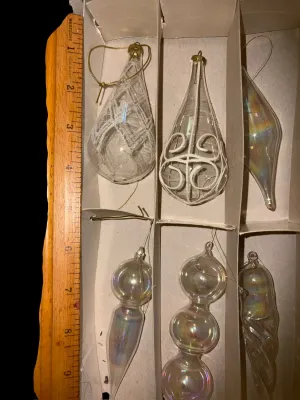 Sale Photo Thumbnail #61: Mixed Lot of Hand-Blown Glass Christmas Ornaments
Beautiful assortment of vintage and newer hand-blown glass Christmas ornaments featuring clear, glittered, swirled, hand-painted, and iridescent Aurora Borealis finishes in a variety of shapes and sizes. I