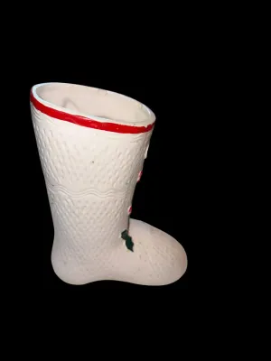 Sale Photo Thumbnail #130: Charming vintage UCAGCO (United China & Glass Company) ceramic Christmas boot planter featuring a whimsical pixie elf dressed in a candy cane-striped outfit, accented with raised holly leaves, berries, and a large green bow. This classic mid-century holid