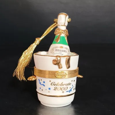 LOT 145: Lenox 8.25" Lily of the Valley Vase, Nantucket Handled Candle Holder, Floral Basket & New Years 2000 Trinket