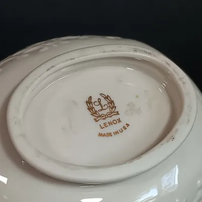 LOT 145: Lenox 8.25" Lily of the Valley Vase, Nantucket Handled Candle Holder, Floral Basket & New Years 2000 Trinket