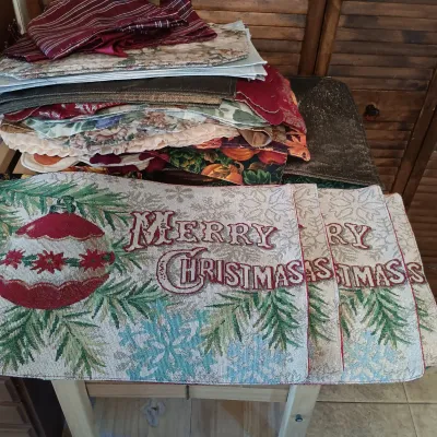 LOT 250: Large Collection of Holiday Linen Placemats and Napkins with NIP Paper Napkins