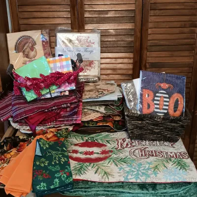 LOT 250: Large Collection of Holiday Linen Placemats and Napkins with NIP Paper Napkins