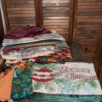 LOT 250: Large Collection of Holiday Linen Placemats and Napkins with NIP Paper Napkins