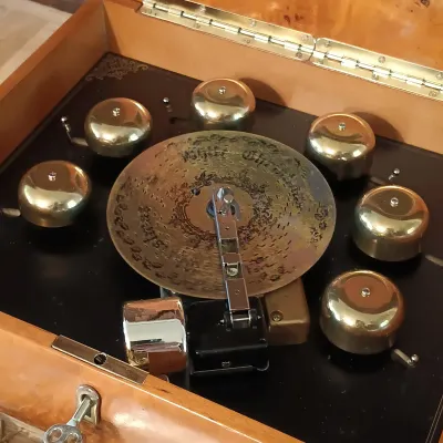 LOT 247: Mr. Christmas Deluxe Bell Symphonium with Records, Western Germany Paper Ornaments, Light-Up Water Lantern & More