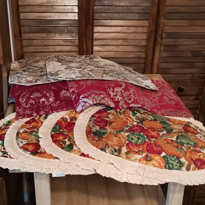 LOT 250: Large Collection of Holiday Linen Placemats and Napkins with NIP Paper Napkins