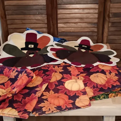 LOT 250: Large Collection of Holiday Linen Placemats and Napkins with NIP Paper Napkins