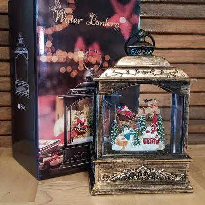 LOT 247: Mr. Christmas Deluxe Bell Symphonium with Records, Western Germany Paper Ornaments, Light-Up Water Lantern & More