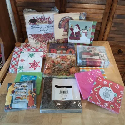 LOT 250: Large Collection of Holiday Linen Placemats and Napkins with NIP Paper Napkins