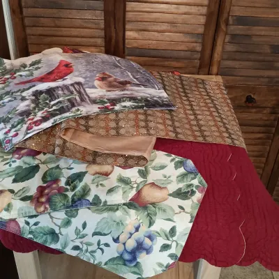 LOT 250: Large Collection of Holiday Linen Placemats and Napkins with NIP Paper Napkins