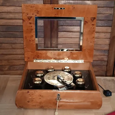 LOT 247: Mr. Christmas Deluxe Bell Symphonium with Records, Western Germany Paper Ornaments, Light-Up Water Lantern & More