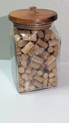 Sale Photo Thumbnail #454: Collecting wine and champagne corks in a decorative jar is a popular and rustic way to display mementos from celebrations and tastings. Because champagne corks are larger and mushroom-shaped, alternating them with standard wine corks adds great visual tex