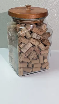 Sale Photo Thumbnail #452: Collecting wine and champagne corks in a decorative jar is a popular and rustic way to display mementos from celebrations and tastings. Because champagne corks are larger and mushroom-shaped, alternating them with standard wine corks adds great visual tex