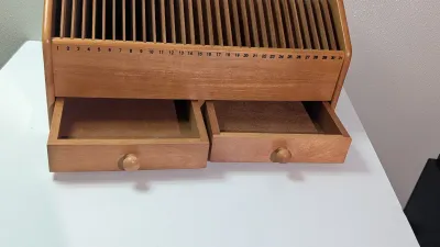 Sale Photo Thumbnail #460: A vintage wooden bill organizer with 31 slots and 2 drawers is a highly practical desktop mail sorter designed to track monthly expenses and correspondence. The 31 vertical slots represent each day of the month, allowing you to file bills, receipts, or re