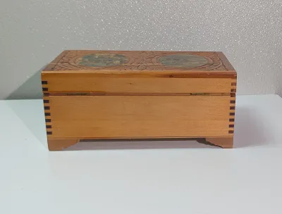 Sale Photo Thumbnail #430: The cedar box with the flower design has a broken latch

Vintage hand-carved cedar jewelry boxes featuring dovetail joints are highly sought-after mid-century collectibles, valued for their aromatic qualities, durability, and distinct folk-art aesthetic. 