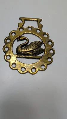 Sale Photo Thumbnail #307: Horse brass bridal medallions (or "horse brasses") are decorative, solid-brass plaques originally used to embellish the bridles and harnesses of working and parade horses. Originating in England in the mid-19th century, carters and farmers first used them