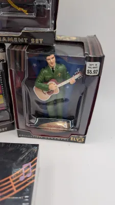 Sale Photo Thumbnail #222: Boxes have damage 

Nostalgic 4-inch pieces frequently feature Elvis in his iconic Aloha shirt strumming a ukulele,


4-inch figure produced by Trevco in 2002. It features Elvis in his iconic black leather outfit from the famous '68 Comeback SpecialThe El