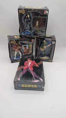 Sale Photo Thumbnail #216: Boxes have damage 

Nostalgic 4-inch pieces frequently feature Elvis in his iconic Aloha shirt strumming a ukulele,


4-inch figure produced by Trevco in 2002. It features Elvis in his iconic black leather outfit from the famous '68 Comeback SpecialThe El