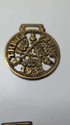 Sale Photo Thumbnail #316: Horse brass bridal medallions (or "horse brasses") are decorative, solid-brass plaques originally used to embellish the bridles and harnesses of working and parade horses. Originating in England in the mid-19th century, carters and farmers first used them