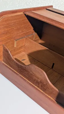 Sale Photo Thumbnail #413: Vintage Mid-Century Modern (MCM) Danish Modern Teak Tambour Roll-Top Box Organizers are highly sought-after collectible pieces designed for both stylish desktop organization and vintage media storage. These functional pieces feature rich solid teak wood g