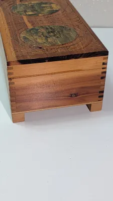 Sale Photo Thumbnail #436: The cedar box with the flower design has a broken latch

Vintage hand-carved cedar jewelry boxes featuring dovetail joints are highly sought-after mid-century collectibles, valued for their aromatic qualities, durability, and distinct folk-art aesthetic. 