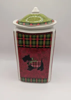 Sale Photo Thumbnail #153: The Christmas Scotty collection by 222 Fifth (PTS) is a highly sought-after holiday dinnerware line featuring a classic Scottish Terrier wearing an argyle sweater, set against a vibrant green, red, and yellow plaid backdrop. Because this specific holiday 