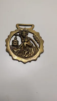 Sale Photo Thumbnail #317: Horse brass bridal medallions (or "horse brasses") are decorative, solid-brass plaques originally used to embellish the bridles and harnesses of working and parade horses. Originating in England in the mid-19th century, carters and farmers first used them