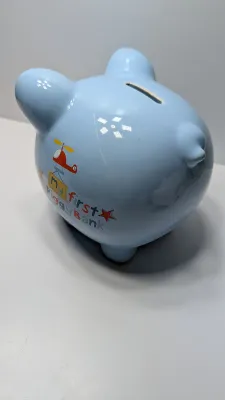 Sale Photo Thumbnail #231: The floral bank is missing the cover on the bottom

Piggy banks are excellent tools for teaching financial responsibility, organizing loose change, or adding a decorative accent to a room. Whether you are looking for a classic keepsake nursery decoration 