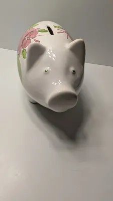 Sale Photo Thumbnail #246: The floral bank is missing the cover on the bottom

Piggy banks are excellent tools for teaching financial responsibility, organizing loose change, or adding a decorative accent to a room. Whether you are looking for a classic keepsake nursery decoration 