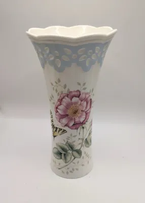 Sale Photo Thumbnail #55: The Lenox Butterfly Meadow vase, designed by artist Louise Le Luyer, is crafted from durable white porcelain and features iconic transferware of vibrant flowers, butterflies, and insects.