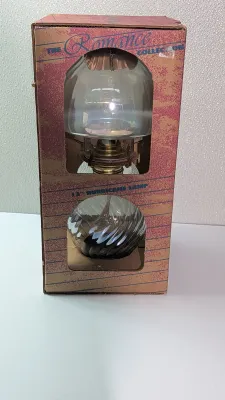 Sale Photo Thumbnail #387: Introducing a stunning addition to your vintage lamp collection - the Romance Collection 13" Glass Hurricane Oil Lamp. This exquisite piece comes in its original packaging and has never been used. Crafted from high-quality glass and finished with an oiled
