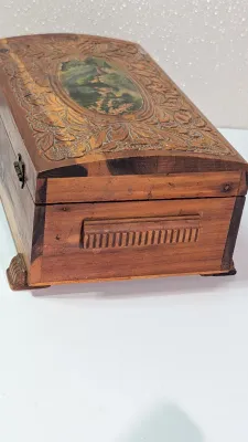 Sale Photo Thumbnail #443: The cedar box with the flower design has a broken latch

Vintage hand-carved cedar jewelry boxes featuring dovetail joints are highly sought-after mid-century collectibles, valued for their aromatic qualities, durability, and distinct folk-art aesthetic. 