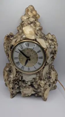 Sale Photo Thumbnail #389: Vintage Hand Crafted Genuine Mother of Pearl Lanshire "Vomit Clock" is a highly collectible Mid-Century Modern (MCM) piece. These kitschy, handmade clocks feature natural materials and colorful resin."Vomit clocks" get their quirky name from the crafting 