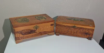 Sale Photo Thumbnail #429: The cedar box with the flower design has a broken latch

Vintage hand-carved cedar jewelry boxes featuring dovetail joints are highly sought-after mid-century collectibles, valued for their aromatic qualities, durability, and distinct folk-art aesthetic. 