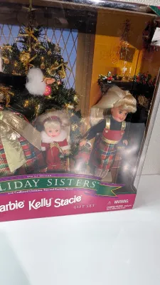 Sale Photo Thumbnail #491: The Barbie Holiday Sisters collection features various iconic multi-doll gift sets released by Mattel in the late 1990s and early 2000s, grouping Barbie, Stacie, and Kelly together in festive Christmas attire
This classic release features the three sister