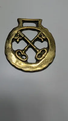 Sale Photo Thumbnail #308: Horse brass bridal medallions (or "horse brasses") are decorative, solid-brass plaques originally used to embellish the bridles and harnesses of working and parade horses. Originating in England in the mid-19th century, carters and farmers first used them