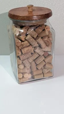 Sale Photo Thumbnail #453: Collecting wine and champagne corks in a decorative jar is a popular and rustic way to display mementos from celebrations and tastings. Because champagne corks are larger and mushroom-shaped, alternating them with standard wine corks adds great visual tex