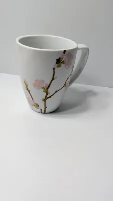 Sale Photo Thumbnail #325: Corelle Cherry Blossom Mugs are a popular discontinued dinnerware line prized for their elegant square silhouette and delicate pink and white floral motif. Unlike Corelle's signature Vitrelle glass plates, these coordinating mugs are crafted from durable,