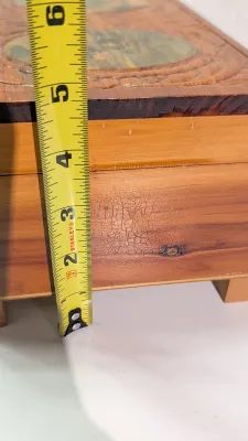 Sale Photo Thumbnail #441: The cedar box with the flower design has a broken latch

Vintage hand-carved cedar jewelry boxes featuring dovetail joints are highly sought-after mid-century collectibles, valued for their aromatic qualities, durability, and distinct folk-art aesthetic. 