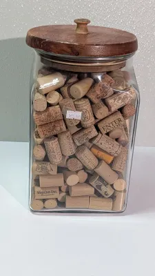 Sale Photo Thumbnail #451: Collecting wine and champagne corks in a decorative jar is a popular and rustic way to display mementos from celebrations and tastings. Because champagne corks are larger and mushroom-shaped, alternating them with standard wine corks adds great visual tex