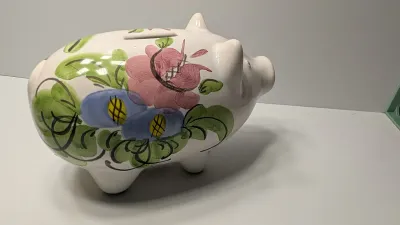 Sale Photo Thumbnail #247: The floral bank is missing the cover on the bottom

Piggy banks are excellent tools for teaching financial responsibility, organizing loose change, or adding a decorative accent to a room. Whether you are looking for a classic keepsake nursery decoration 